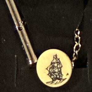 Elegant Gold and Black Ship Pendant Necklace
Box1